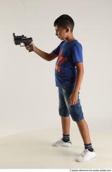 TIMBO STANDING POSE WITH GUN